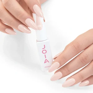 JOIA Vegan Gel Polish 006 Soft Creamy Peach Nude 6ml — hand holding bottle with painted nails