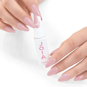 JOIA Vegan Gel Polish 009 Muted Rosy Mauve 6ml — hand holding bottle with painted nails
