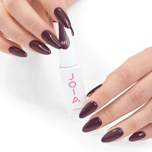 JOIA Vegan Gel Polish 041 Dark Plum Brown 6ml — hand holding bottle with painted nails