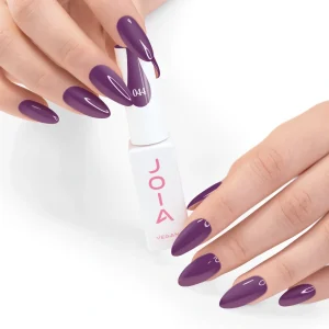 JOIA Vegan Gel Polish 044 Dark Plum 6ml — hand holding bottle with painted nails