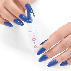 JOIA Vegan Gel Polish 046 Royal Cobalt Blue 6ml — hand holding bottle with painted nails