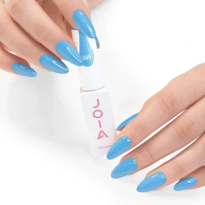 JOIA Vegan Gel Polish 048 Light Sky Blue 6ml — hand holding bottle with painted nails