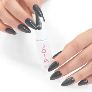 JOIA Vegan Gel Polish 058 Graphite Grey 6ml — hand holding bottle with painted nails