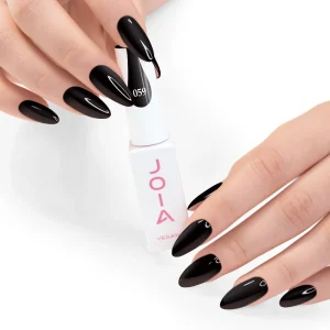 JOIA Vegan Gel Polish 059 Jet Black 6ml — hand holding bottle with painted nails