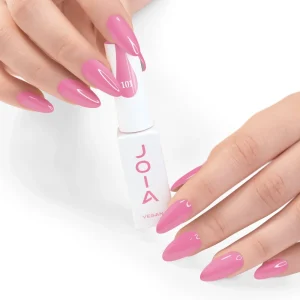 JOIA Vegan Gel Polish 101 Candy Pink 6ml — hand holding bottle with painted nails