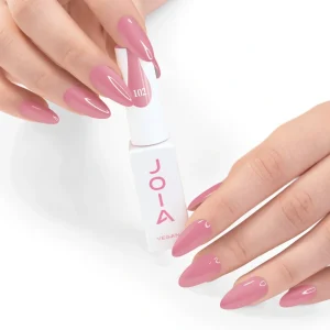 JOIA Vegan Gel Polish 102 Soft Rose Pink 6ml — hand holding bottle with painted nails